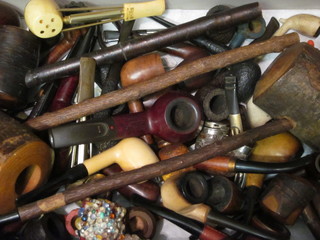 A box containing a collection of pipes
