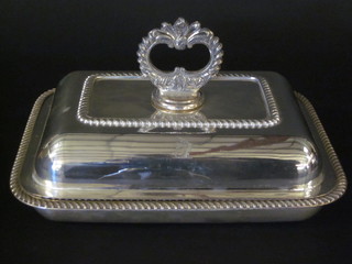 A rectangular silver plated entree dish and cover with gadrooned border