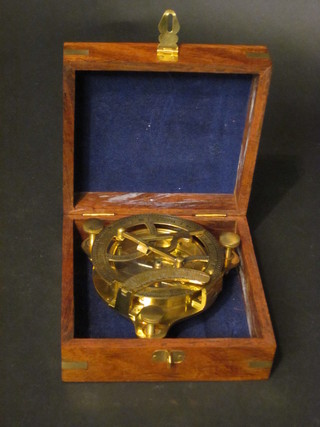 A reproduction circular brass sextant, cased