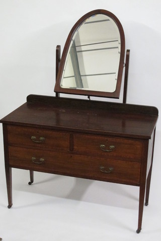 An Edwardian inlaid mahogany dressing chest with arch shaped  plate mirror, the base fitted 2 long and 1 short drawer, raised on  square tapering supports 42"