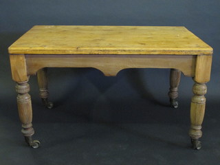 A Victorian pine and oak rectangular kitchen table, raised on  turned and reeded supports 51"