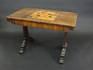 A William IV rectangular rosewood library table, the top inlaid a chessboard and raised on standard end supports, fitted a drawer  42"