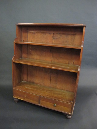 A 19th Century mahogany 3 tier waterfall bookcase, the base fitted 2 drawers and raised on turned supports 40"