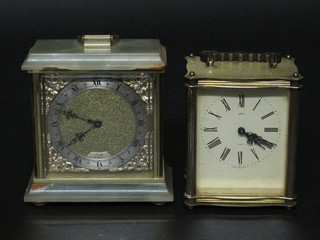 A battery operated carriage clock contained in an onyx case together with a gilt metal ditto