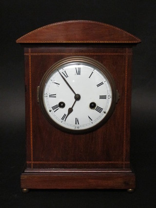 An Edwardian 8 day striking bracket clock with enamelled dial  and Roman numerals, contained in an inlaid mahogany arched  case