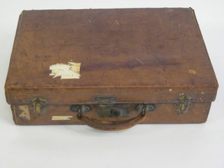 A leather case with brass fittings by D E Evans & Co