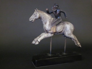 A resin figure of a carousel horse and rider 16"