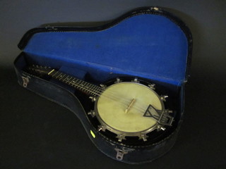 An 8 stringed banjo, the head marked John Grandsons of  London, contained in a fibre carrying case