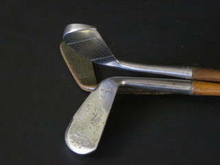 A hickory shafted MacGregor Nokorode Dayton putter 10-X, an HB Sugg Ltd Mashie and 1 other golf club