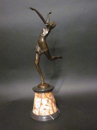 An Art Deco style bronze figure of a dancing girl, raised on a conical marble base, 25"