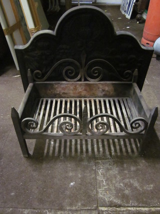 A cast iron fire back 29" together with a fire basket 25" x 14"