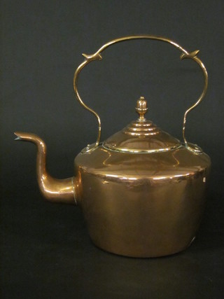 A large 19th Century copper kettle with acorn finial