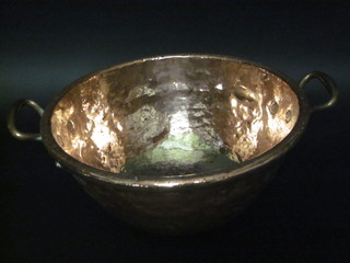 A circular copper twin handled pot 15"