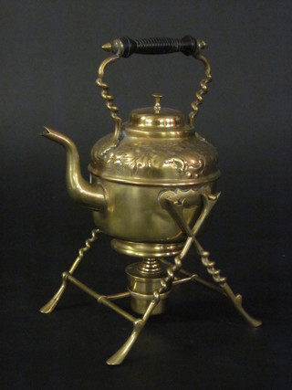 An embossed copper spirit kettle complete with burner