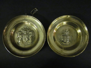 A pair of embossed brass plates with armorial decoration 9 1/2"