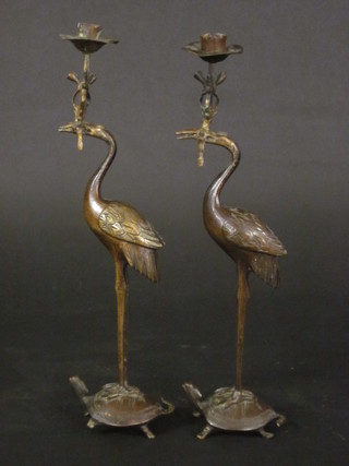 A pair of 19th Century bronze candlesticks in the form of storks standing upon turtles 14"