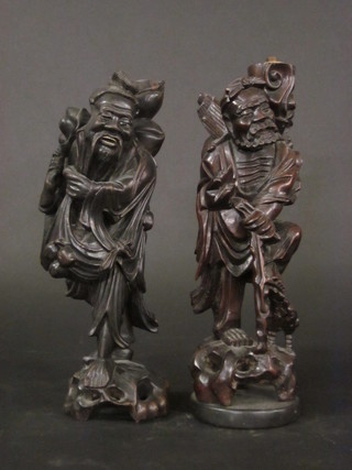A pair of Oriental carved hardwood figures of sages 14"