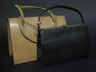 A black lizard handbag and a lady's brown leather handbag