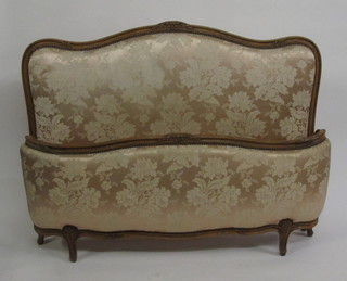 A French 19th Century carved walnut and upholstered panel end bedstead, comprising head and foot board and complete with  rails, 60"