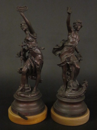 A pair of spelter figures depicting Industry, raised on turned  socle bases 18"  ILLUSTRATED
