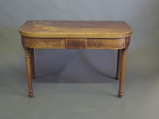 A 19th Century mahogany D shaped tea table, raised on turned supports 43"