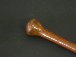 A mahogany walking cane