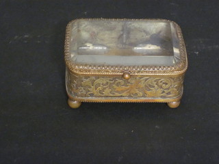 A 19th Century brass and ivory quill cutter 4" together with a Victorian gilt metal and glass "relic" box 3"