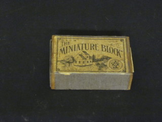 A childs miniature block wooden puzzle