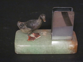 A cold painted bronze match striker decorated a standing duck,  raised on a marble base, 3"