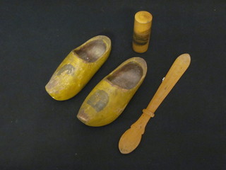 A Victorian treen paper knife decorated scenes of Sidmouth, do.  pair of clogs and a cylindrical jar and cover decorated scenes of  Folkestone