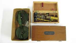 A student's brass pillar single microscope contained in a  mahogany case, a mahogany instrument box marked Admiralty  Patent 43, together with a Spong bean slicer
