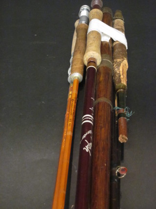 A bamboo twin section fishing rod together with a bundle of fishing rods, mostly f,