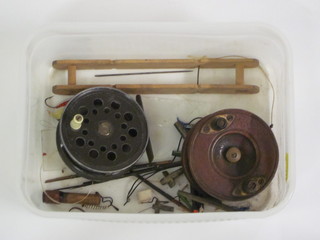 A metal centre pin fly reel 3", a wooden fishing reel 3", 4 metal lures etc