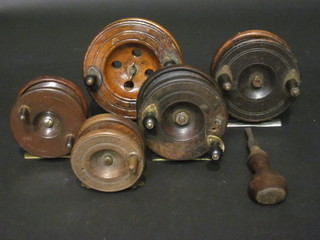 5 various wooden centre pin fishing reels and a wooden  screwdriver