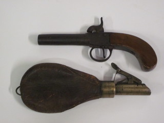 A 19th Century box lock percussion pocket pistol with 3" barrel  together with a leather and brass shot flask, f,