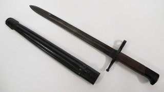 An "Italian" single bladed bayonet with 12" blade and leather scabbard  ILLUSTRATED