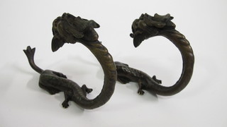 A pair of bronze curtain "tie backs/hooks" in the form of  mythical beasts 6"