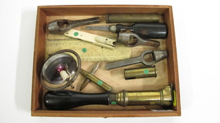 An ivory and brass quill cutter and various gauges, together with  3 wad punches etc