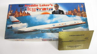A Revel Sir Freddy Laker model Sky Train, together with a brass plaque marked First Delivery to Laker Airways 303 Sky Train  G.Bima January 1981