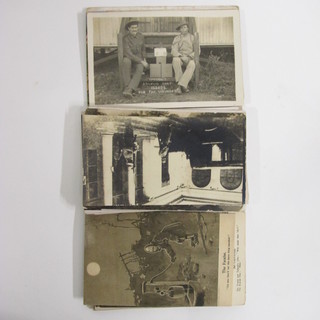 A collection of black and white military and other postcards