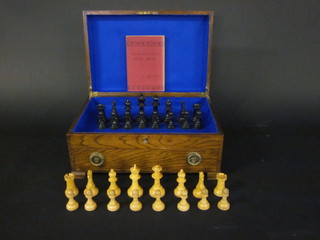 A Staunton chess set and 1 volume H Staunton The Chess  Player's Text Book contained in an oak canteen box