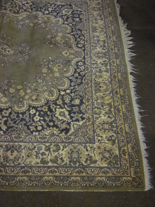 A green ground machine made Persian style rug with central  medallion 117" x 79"