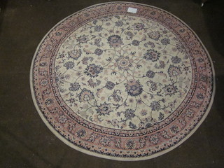 A machine made circular pink ground and floral patterned rug  76"