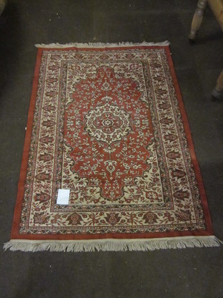 A tan ground Persian rug 76" x 55"