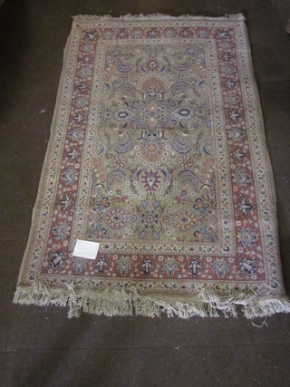 A fine quality tan ground Persian carpet with floral central field  within multi row borders 78" x 49"