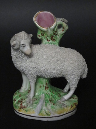 A 19th Century Staffordshire spill vase in the form of standing sheep 7"