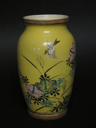 A yellow glazed Oriental vase decorated bird amidst branches,  the base with 6 character mark 8"