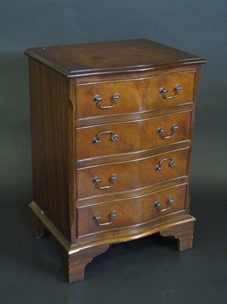 A Georgian style mahogany chest of serpentine outline fitted 4  long drawers with brass swan neck drop handles, raised on  bracket feet 20"