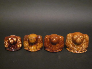 4 Staffordshire treacle glazed money boxes in the form of  Spaniels 3"