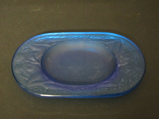 An Art Deco oval blue Lalique glass pin/ashtray decorated figures of reclining naked ladies, the reverse marked R Lalique  6"